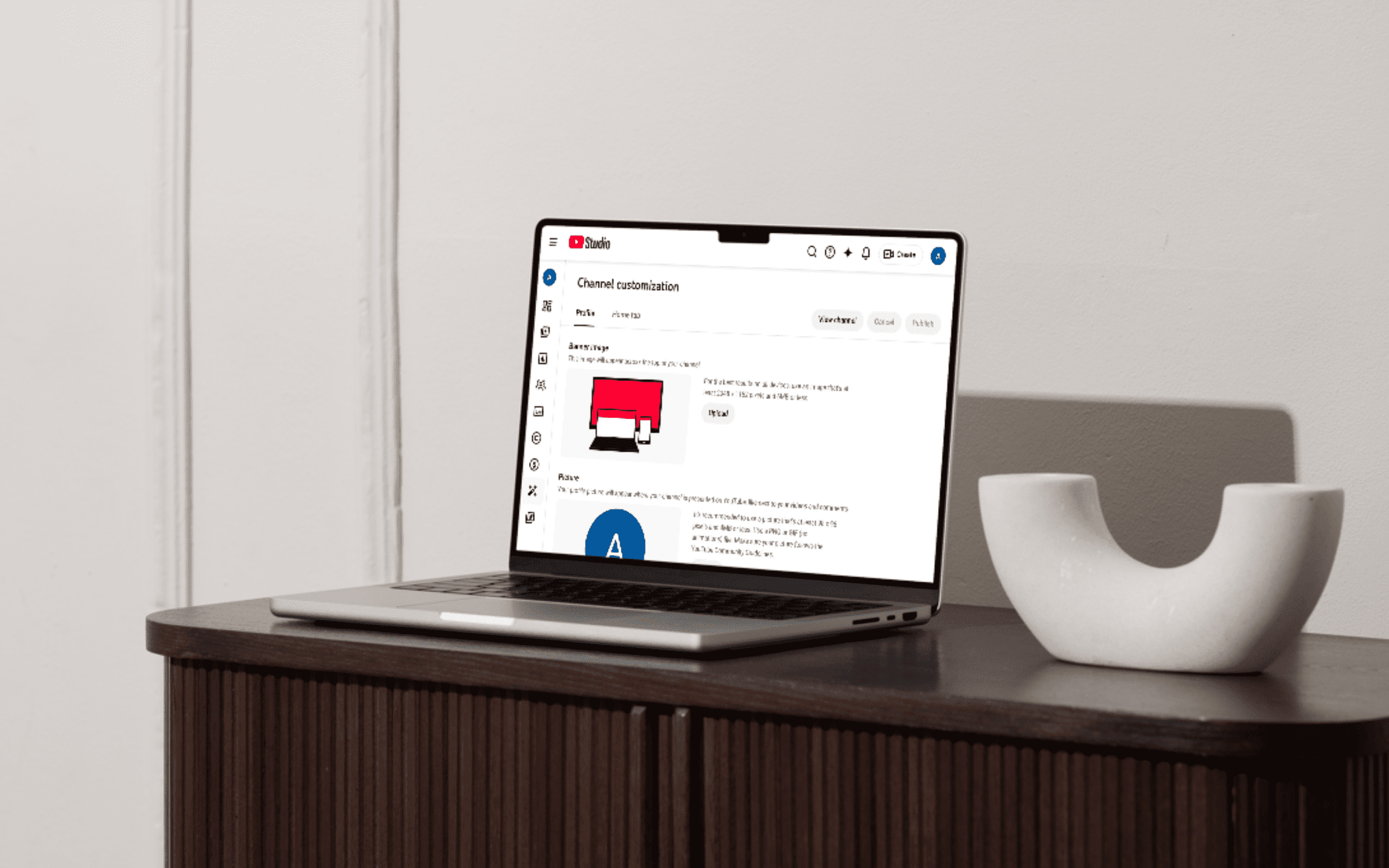 YouTube Studio channel customization dashboard open on a laptop